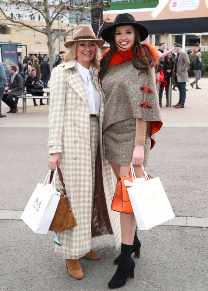 Two woman clutching bags appeared in high spirits for the day ahead