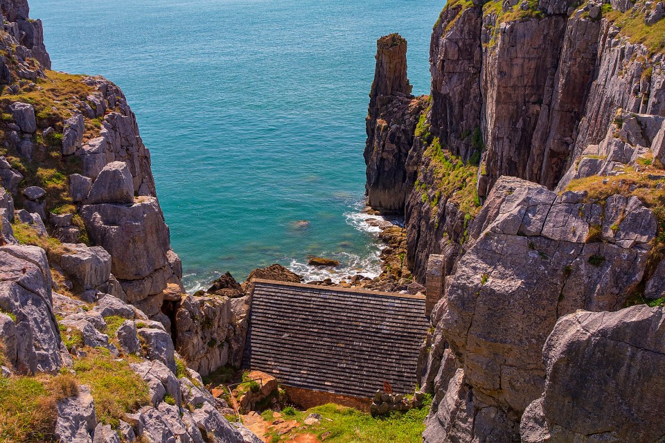 The chapel is built into the rock overlooking the beach