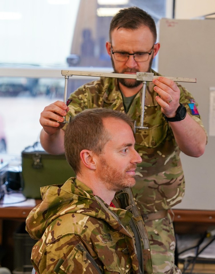 Sun man Alex is measured up for an £80,000 helmet