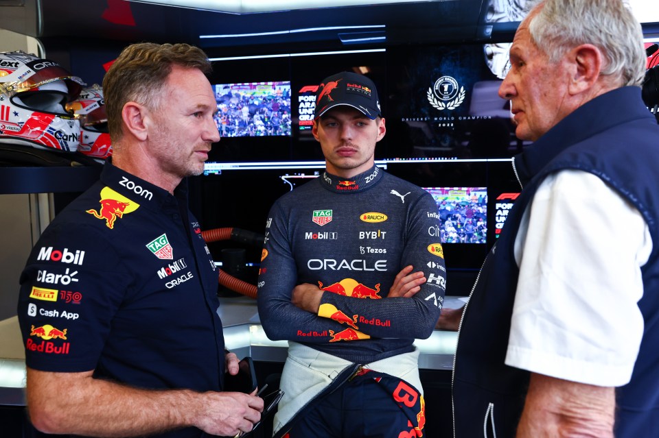 Max Verstappen, centre, talks with Horner, left, and Red Bull Racing Team Consultant Dr Helmut Marko, right