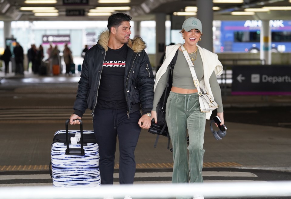 The couple looked in good spirits after meeting at Edinburgh airport