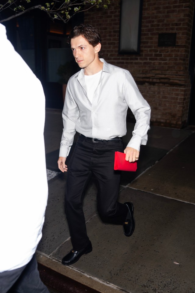 Tom Holland looked smart as he was snapped going into the Big Apple’s The Crosby Bar