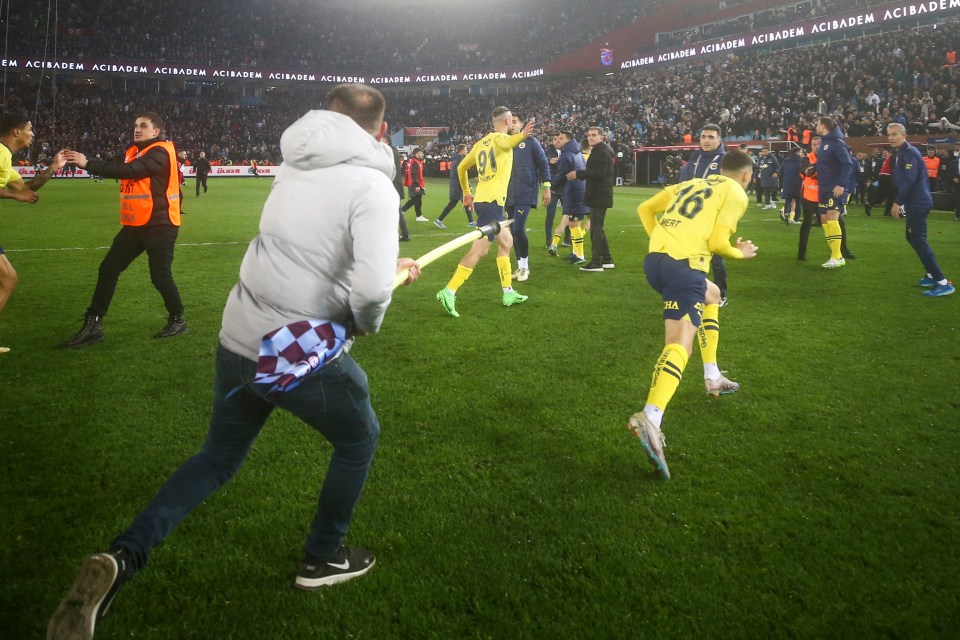 Muldur was chased down by a Trabzonspor fan wielding a corner flag