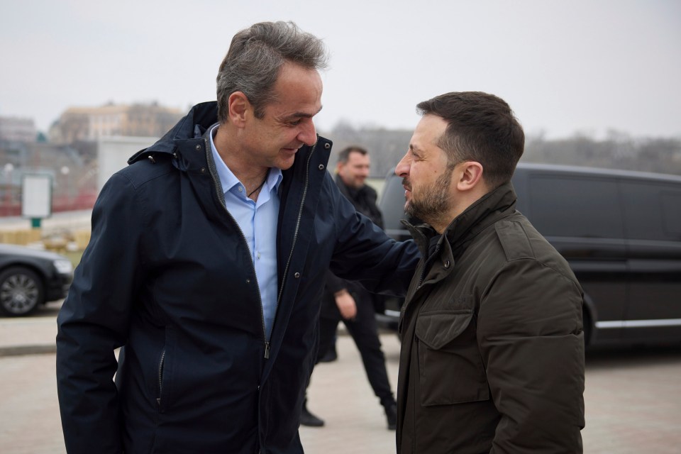 Zelensky, right, welcomes Mitsotakis, left