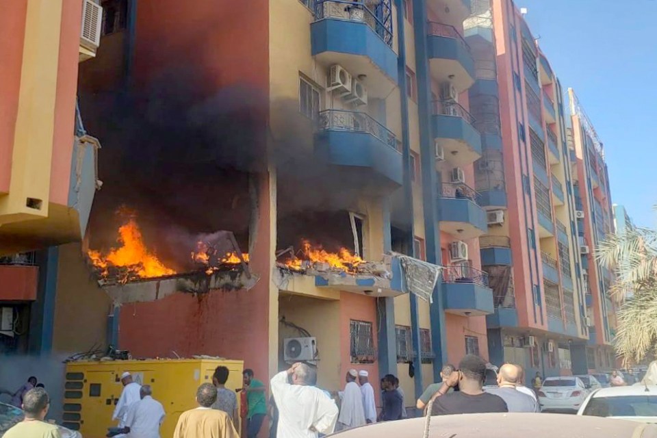 A fire breaks out after a house was hit in the Lamab district during clashes between the SAF and the RSF in April last year