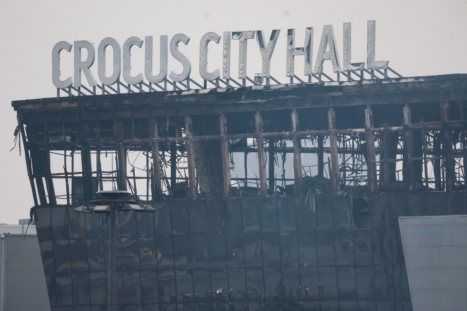 Outside the venue with the burnt roof on display