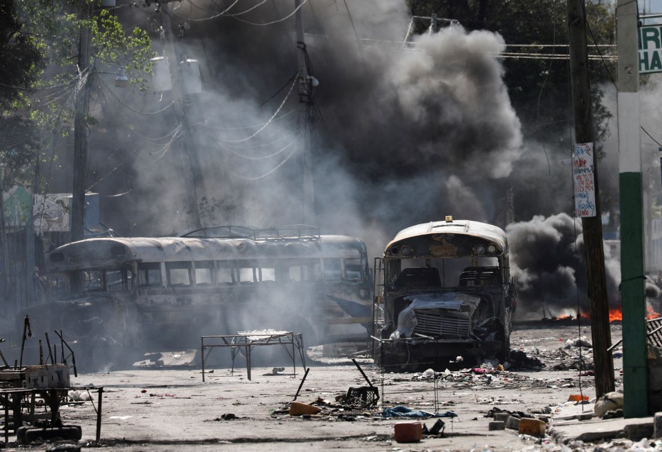 The smouldering wreckage of buses and bodies line the streets