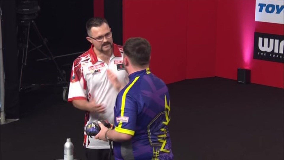 Littler appeared to turn his back on the Aussie after the final dart