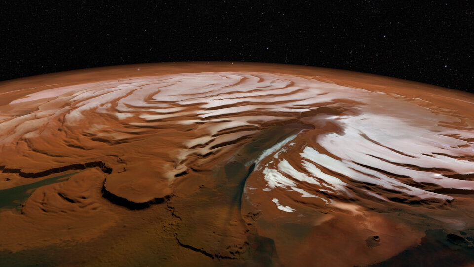 The swirling dark spiral of ice that crowns the Martian North Pole look stunning