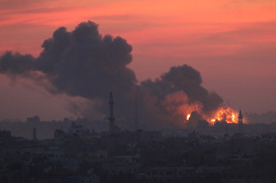 An Israeli fighter jet flies above Rafah in the southern Gaza Strip