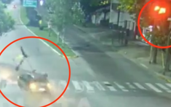 The moment the woman rammed her overspeeding car into the biker