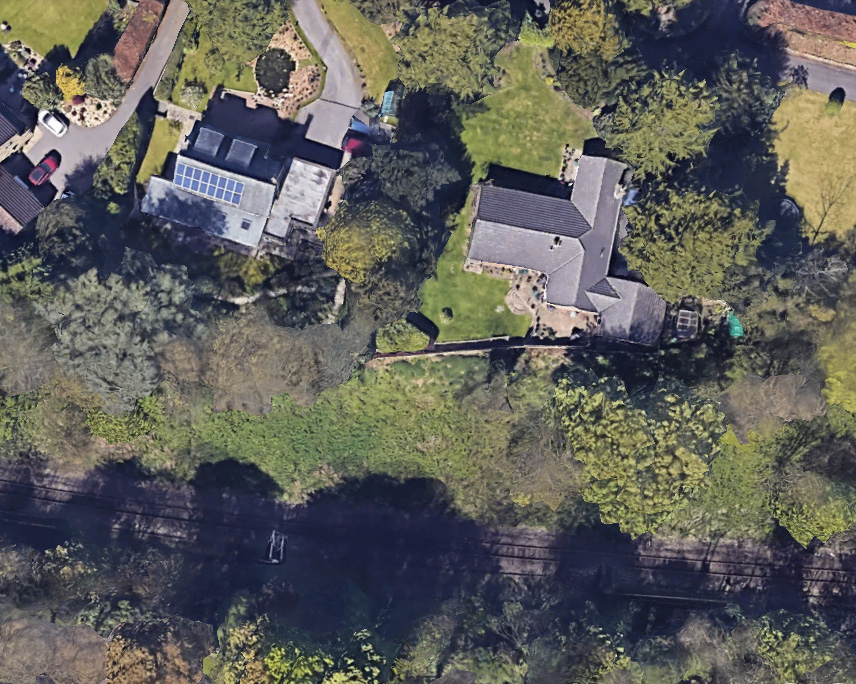 A Google Earth image shows the two homes prior to the natural disaster