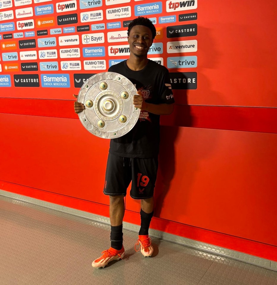 Nathan Tella celebrates with the Bundesliga trophy