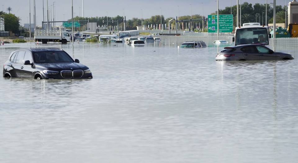 Cars have been submerged by floodwater as Dubai struggles to drain away the masses of water