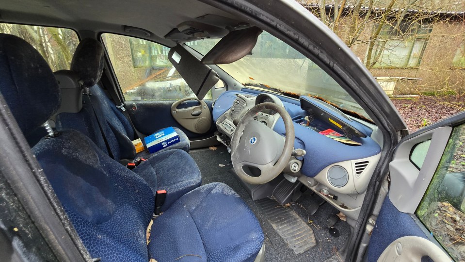 Amongst the graveyard is abandoned FIAT car