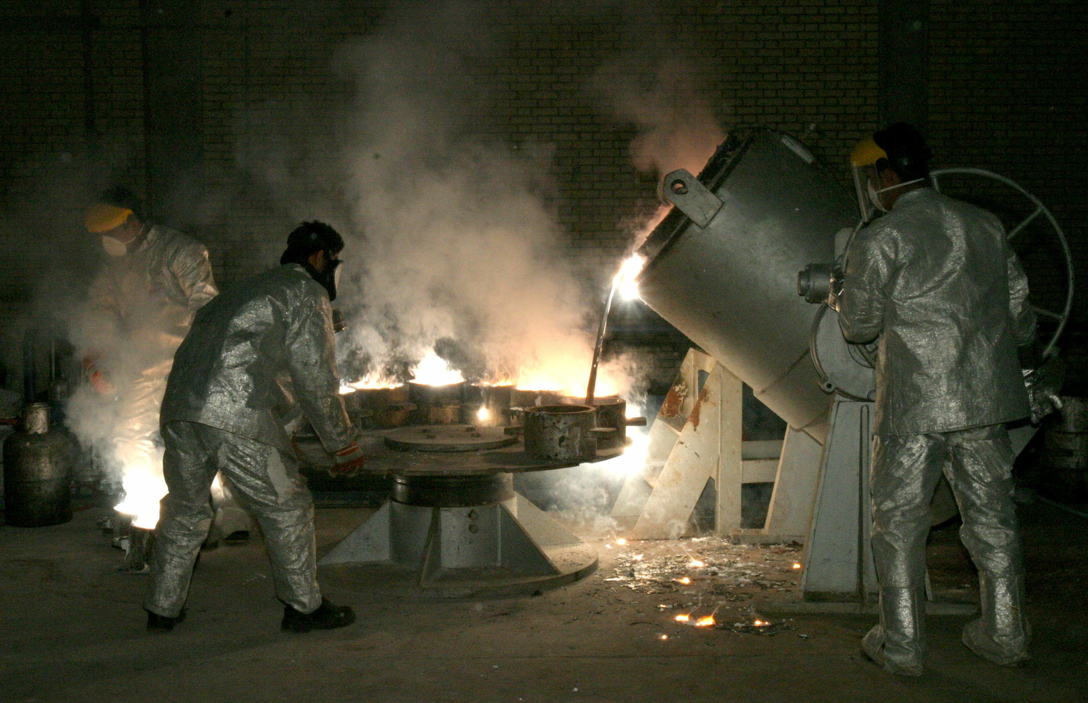 Iranian technicians work at one of the country's uranium sites