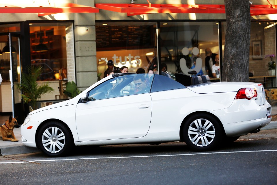 Sukur parked outside his former bakery, Tuts