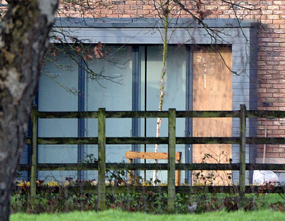 The boarded-up windows of Raheem's home, in Holmes Chapel, shortly after the burglary