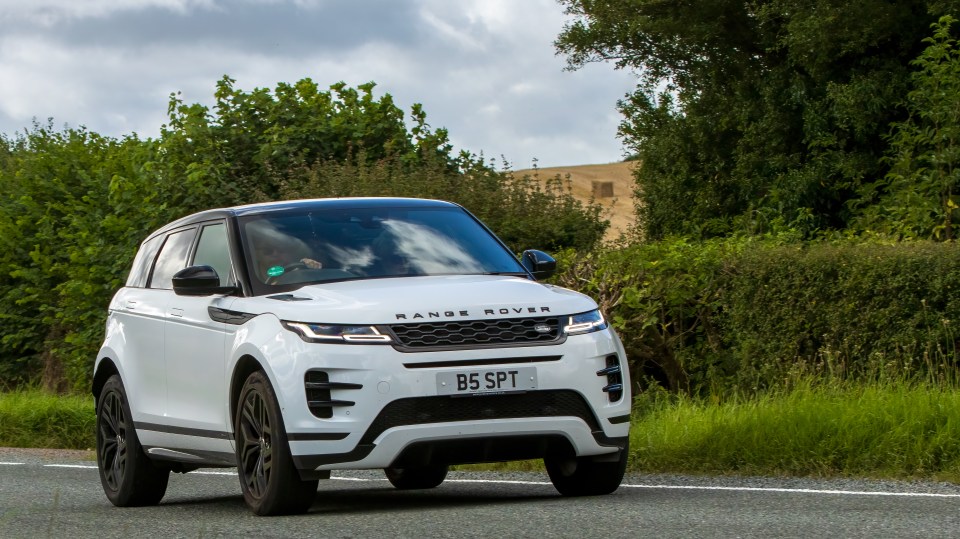 They built a £20,000 double garage to keep all their cars - including their lavish Range Rover