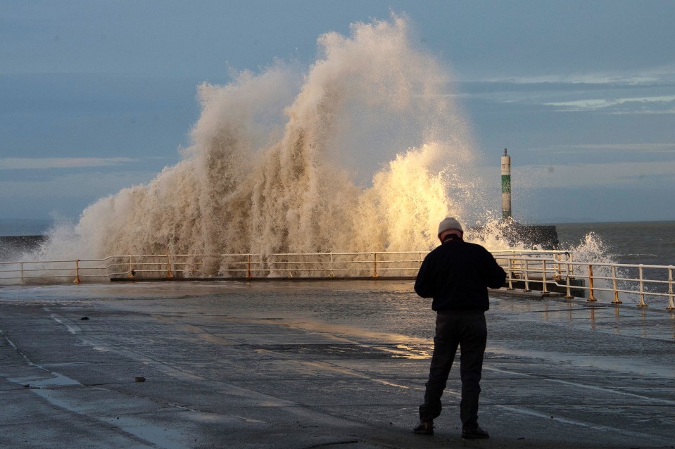 A monster wave crashes into the coast at Aberystwyth in Wales