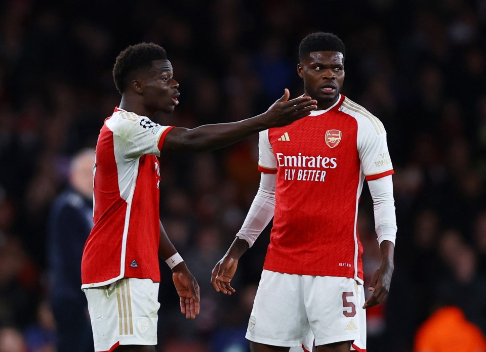 Gunners' winger Saka and team-mate Thomas Partey were locked in animated debate following a contentious climax to a dramatic draw