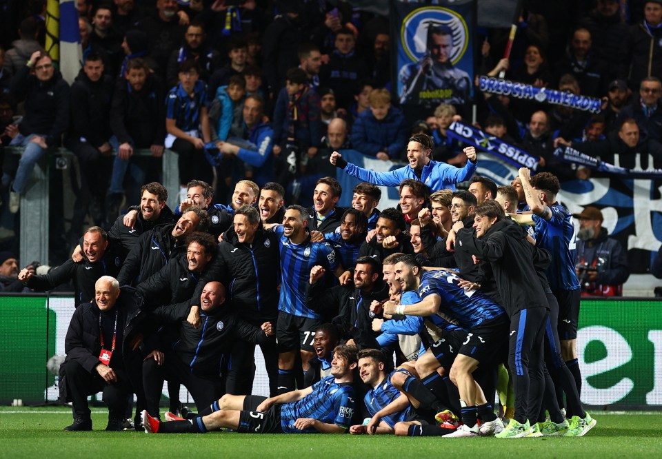 Atalanta pose for a team group photo after securing the famous victory