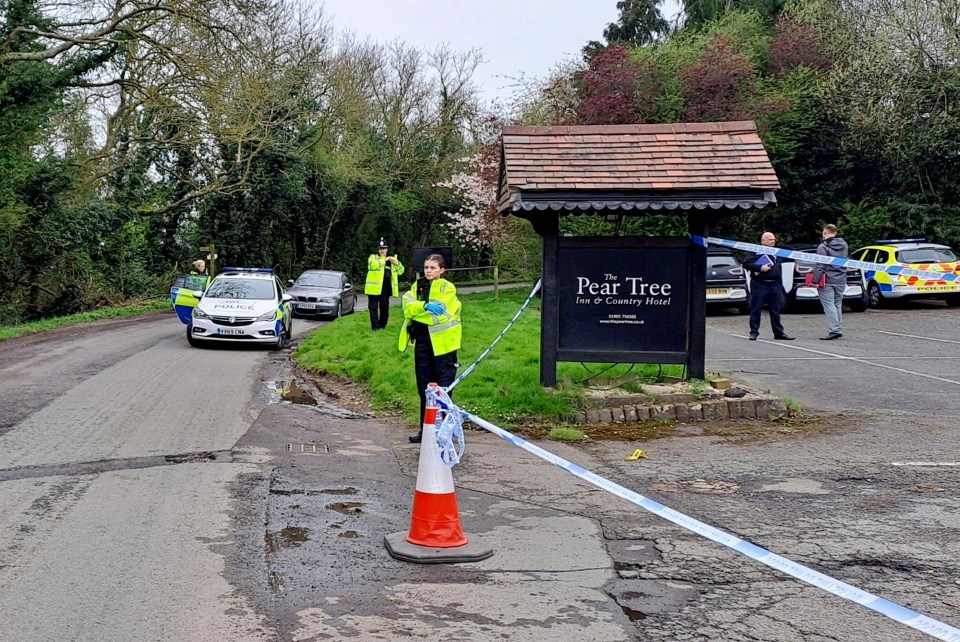 Police and forensic officers at the Pear Tree Inn & Country Hotel near Worcester