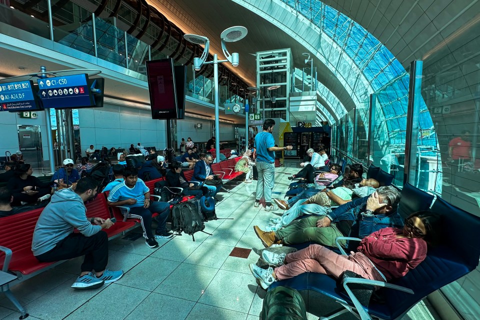 Passengers wait for their flights at the Dubai International Airport on Wednesday