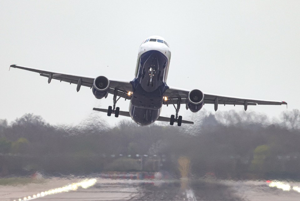 A plane battling the wind as it comes into Gatwick airport this morning