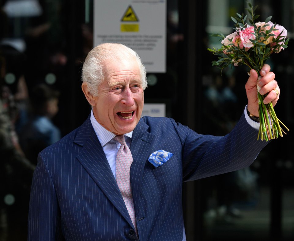 Charles with flowers given to him by a young girl