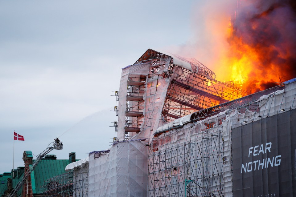 Firefighters desperately battling to put out the flames on historic landmark