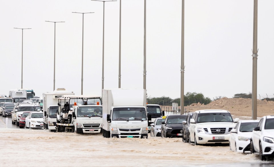 Cars are forced to a standstill on flooded roads