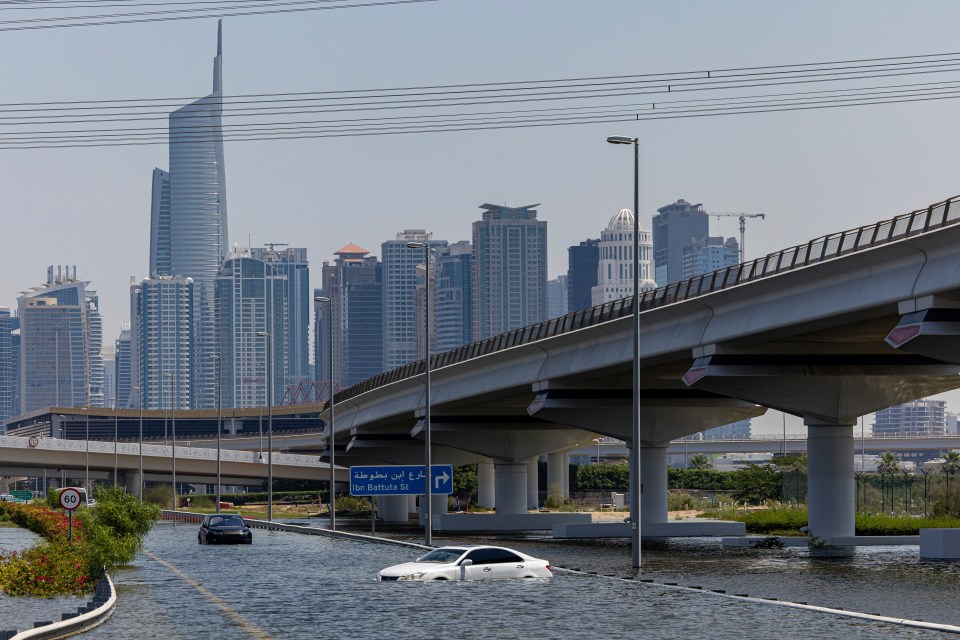 Vehicles were abandoned in floodwater caused by heavy rain in Dubai after an unprecented downpour