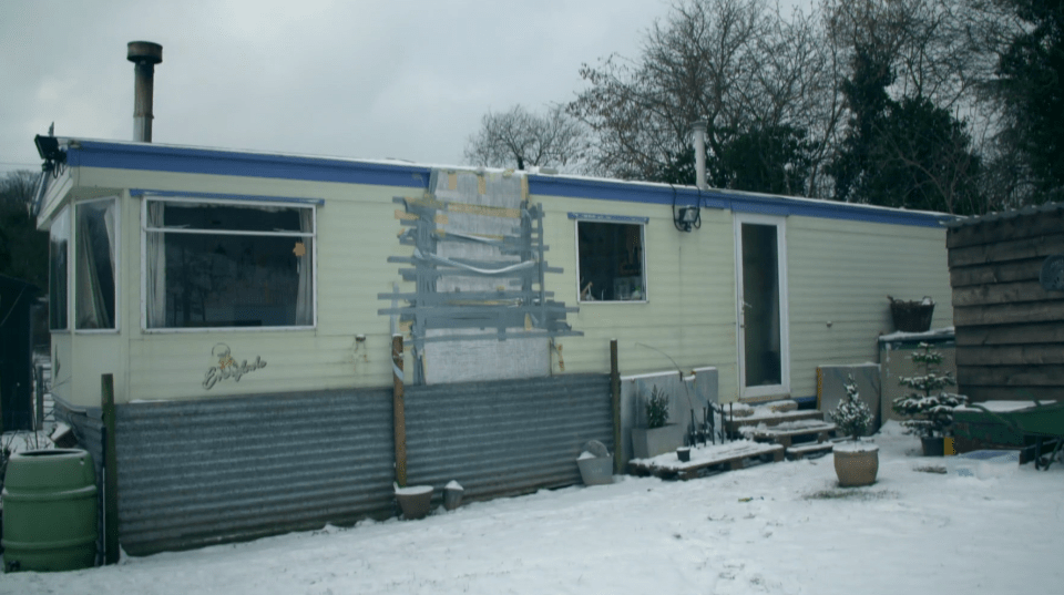 The couple moved into a caravan for three years, using tape to insulate a drafty door