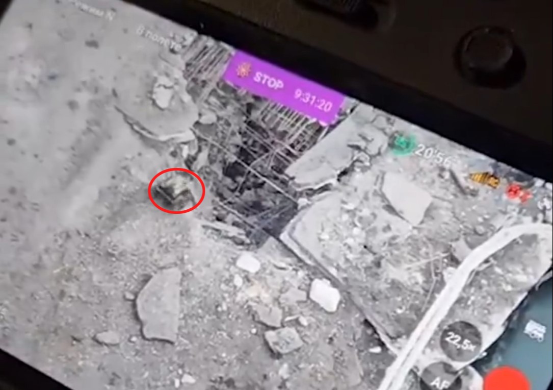 A view from the drone operator's screen showing how Ukraine's 'Honey Badger' land drone is directed into a crack in the bridge