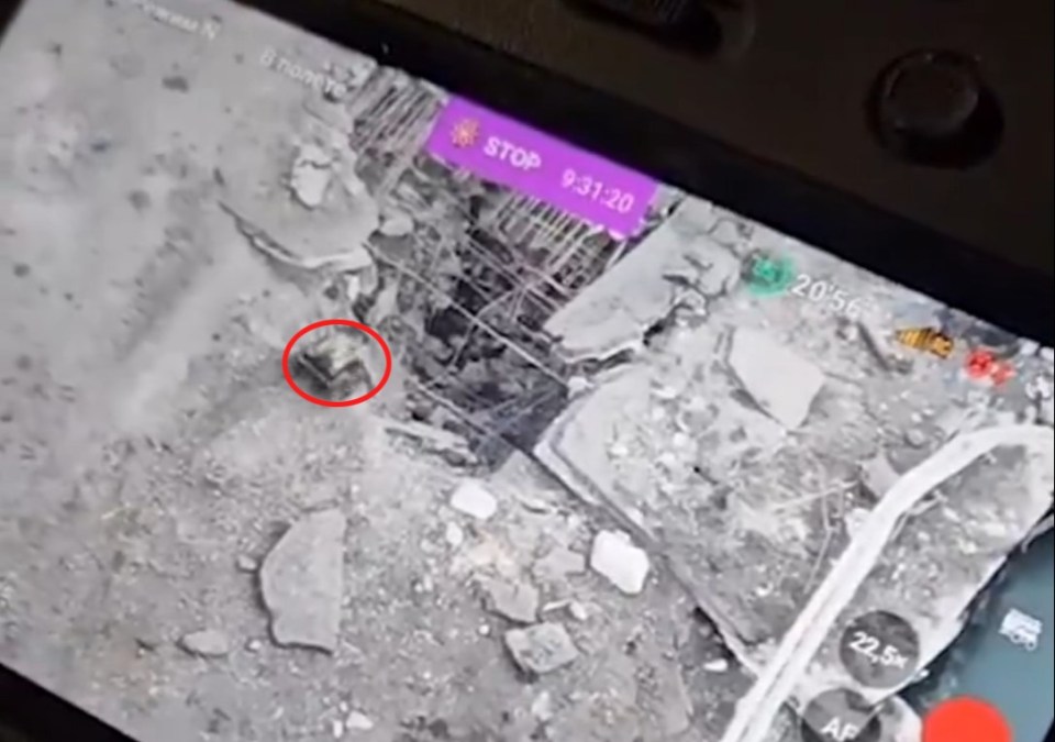 A view from the drone operator's screen showing how the 'Honey Badger' is directed into a crack in the bridge