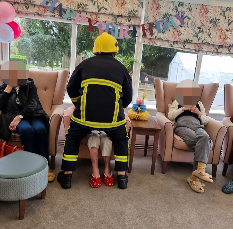 Gary Maloney starts a lap dance routine at a care home in a fireman's uniform