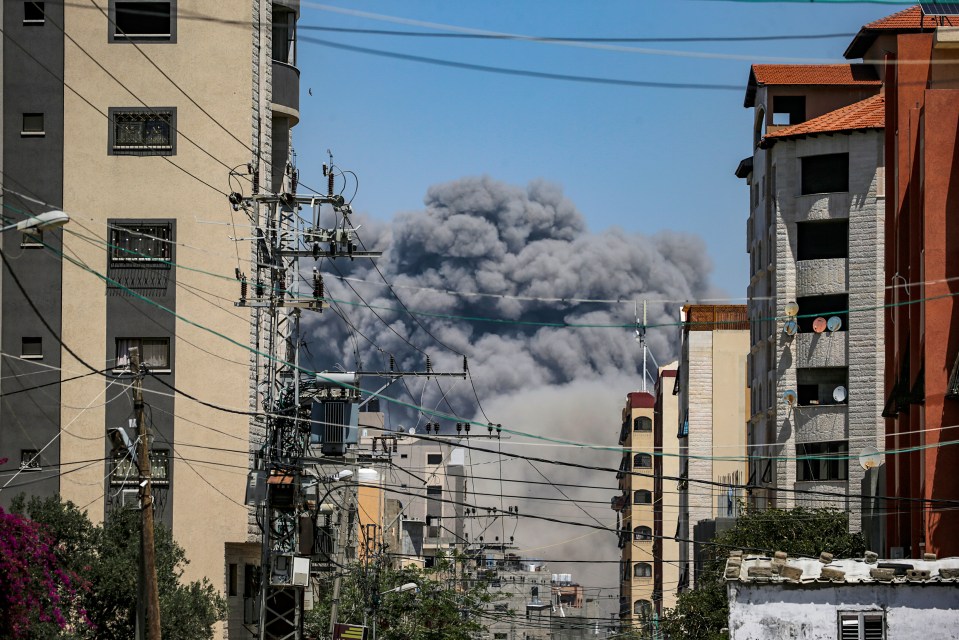 Smoke rises after an explosion following an Israeli air strike in Gaza yesterday