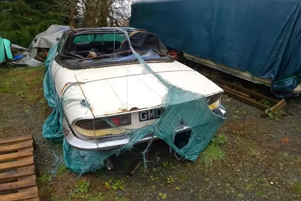 The Triumph convertible sports car from the 70s has its seats and floors destroyed by rain