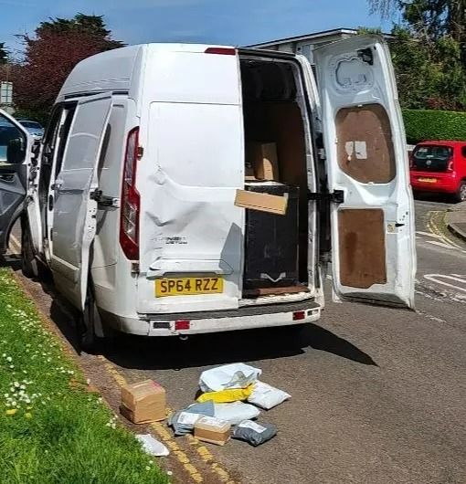 Maciej Olszewski said he didn't confront the driver who can be seen here hurling a large box out the back of a smashed up white van