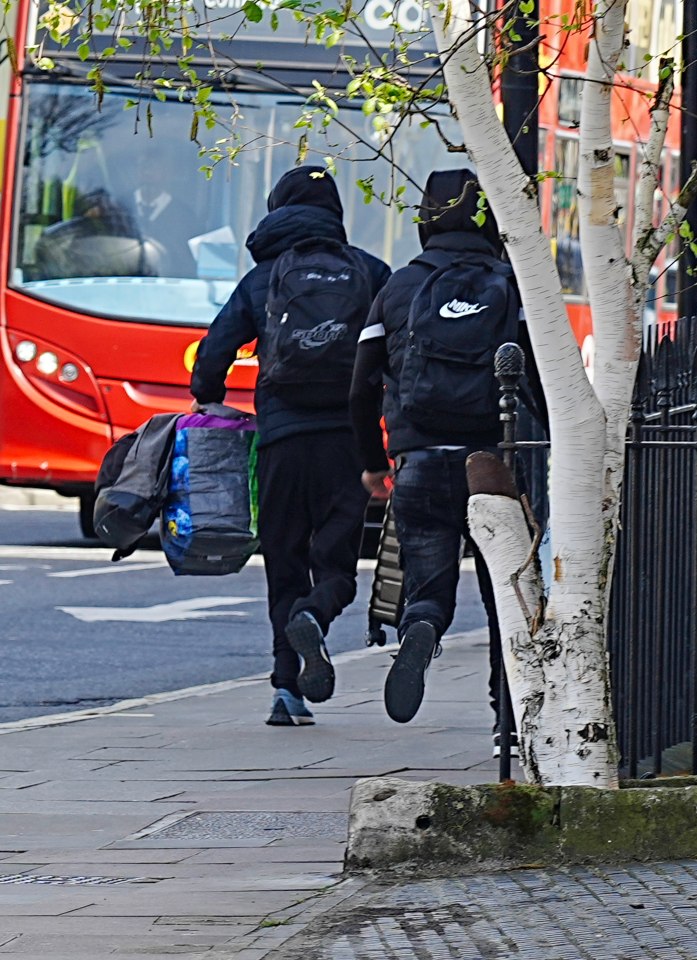 The fellas were snapped legging it down the road