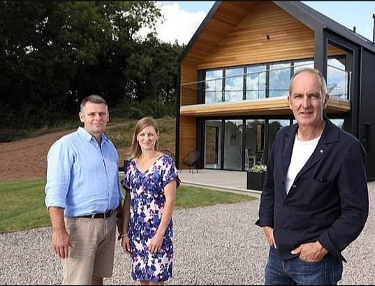 Steph Wilson and husband Alex shared their newbuild journey with Grand Designs host Kevin McCloud (right)