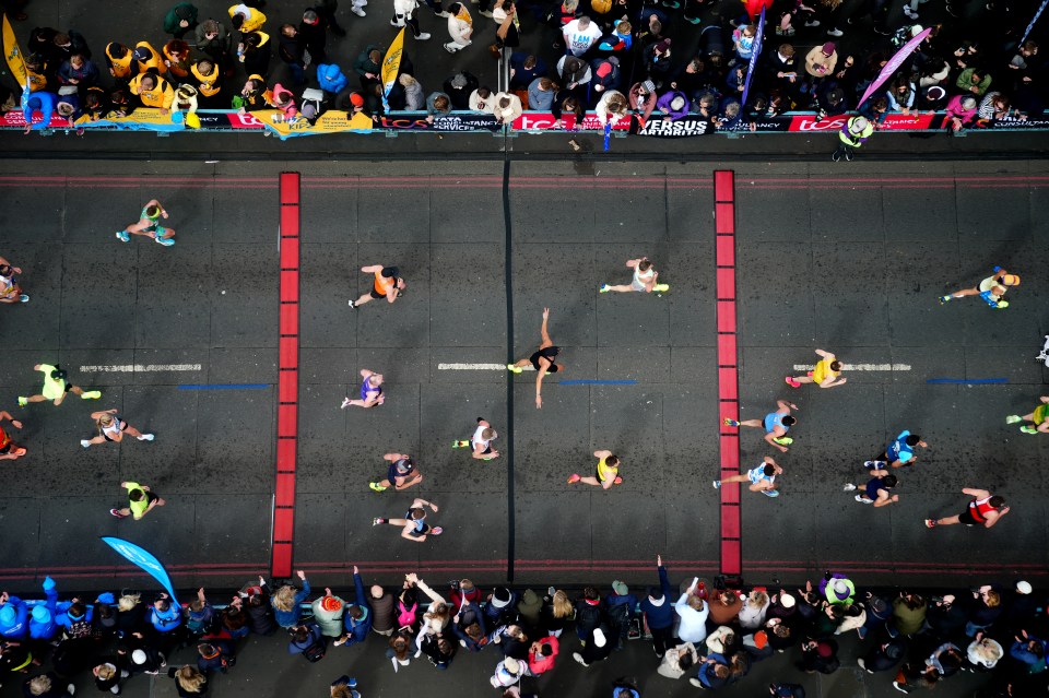 Masses crossing Tower Bridge during the TCS London Marathon. Picture date: Sunday April 21, 2024. PA Photo. See PA story ATHLETICS London. Photo credit should read: Aaron Chown/PA Wire. RESTRICTIONS: Use subject to restrictions. Editorial use only, no commercial use without prior consent from rights holder.