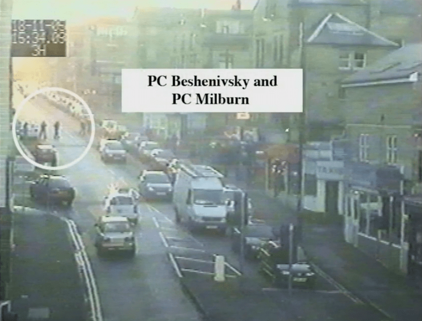 Footage shows the two officers heading towards the robbery