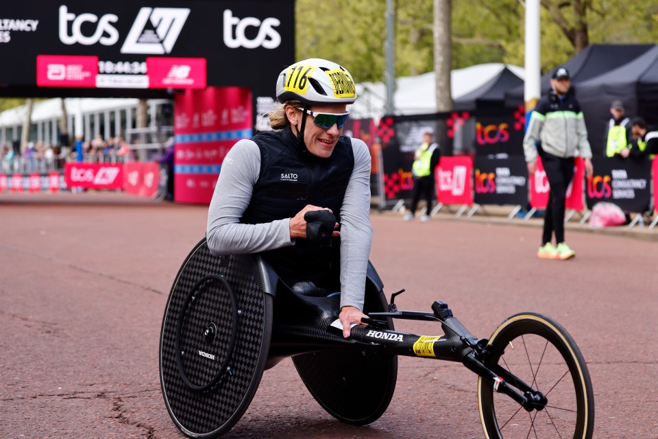 epa11291257 Switzerland's Catherine Debrunner finishes first in womenÂ’s wheelchair race of the London Marathon in London, Britain, 21 Apr 2024. Taking place since 1981, the London Marathon is one of the most popular marathons in the world, with a record number of 65,725 people registered to run in 2024. EPA/TOLGA AKMEN