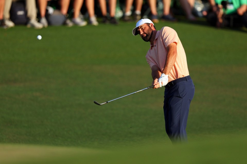 AUGUSTA, GEORGIA - APRIL 14: Scottie Scheffler of the United States plays his shot on the 18th hole during the final round of the 2024 Masters Tournament at Augusta National Golf Club on April 14, 2024 in Augusta, Georgia. (Photo by Andrew Redington/Getty Images)