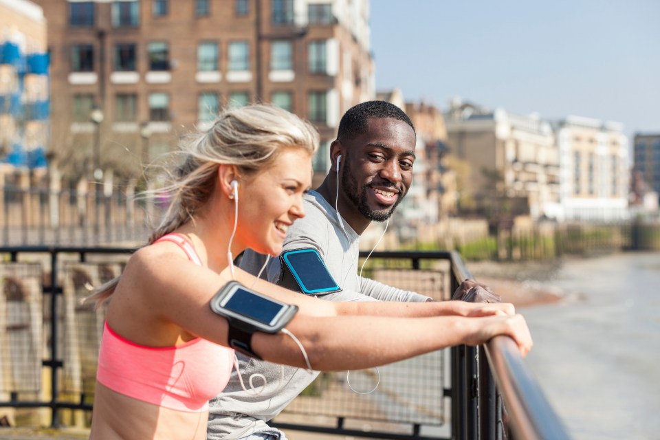 UK, London, two people doing fitness exercises together