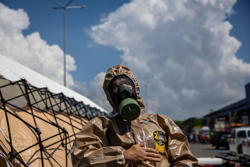 An Ukrainian Emergency Ministry rescuer attends an exercise in the city of Zaporizhzhia on August 17, 2022, in case of a possible nuclear incident at the Zaporizhzhia nuclear power plant located near the city. - Ukraine remains deeply scarred by the 1986 Chernobyl nuclear catastrophe, when a Soviet-era reactor exploded and streamed radiation into the atmosphere in the country's north. The Zaporizhzhia nuclear power plant in southern Ukraine was occupied in the early days of the war and it has remained in Russian hands ever since. (Photo by Dimitar DILKOFF / AFP) (Photo by DIMITAR DILKOFF/AFP via Getty Images)