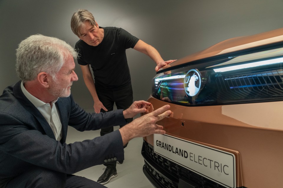 Design chief Mark Adams, left, show The Sun's Rob Gill around the new motor