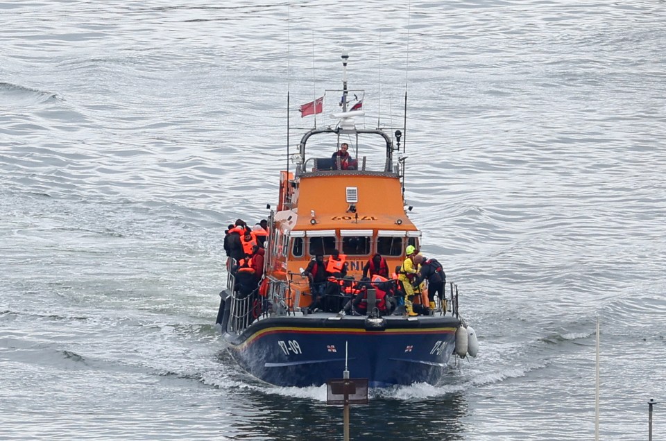 A lifeboat carrying people, believed to be migrants, navigates as seen from the Port of Dover, Britain, April 23, 2024. REUTERS/Toby Melville